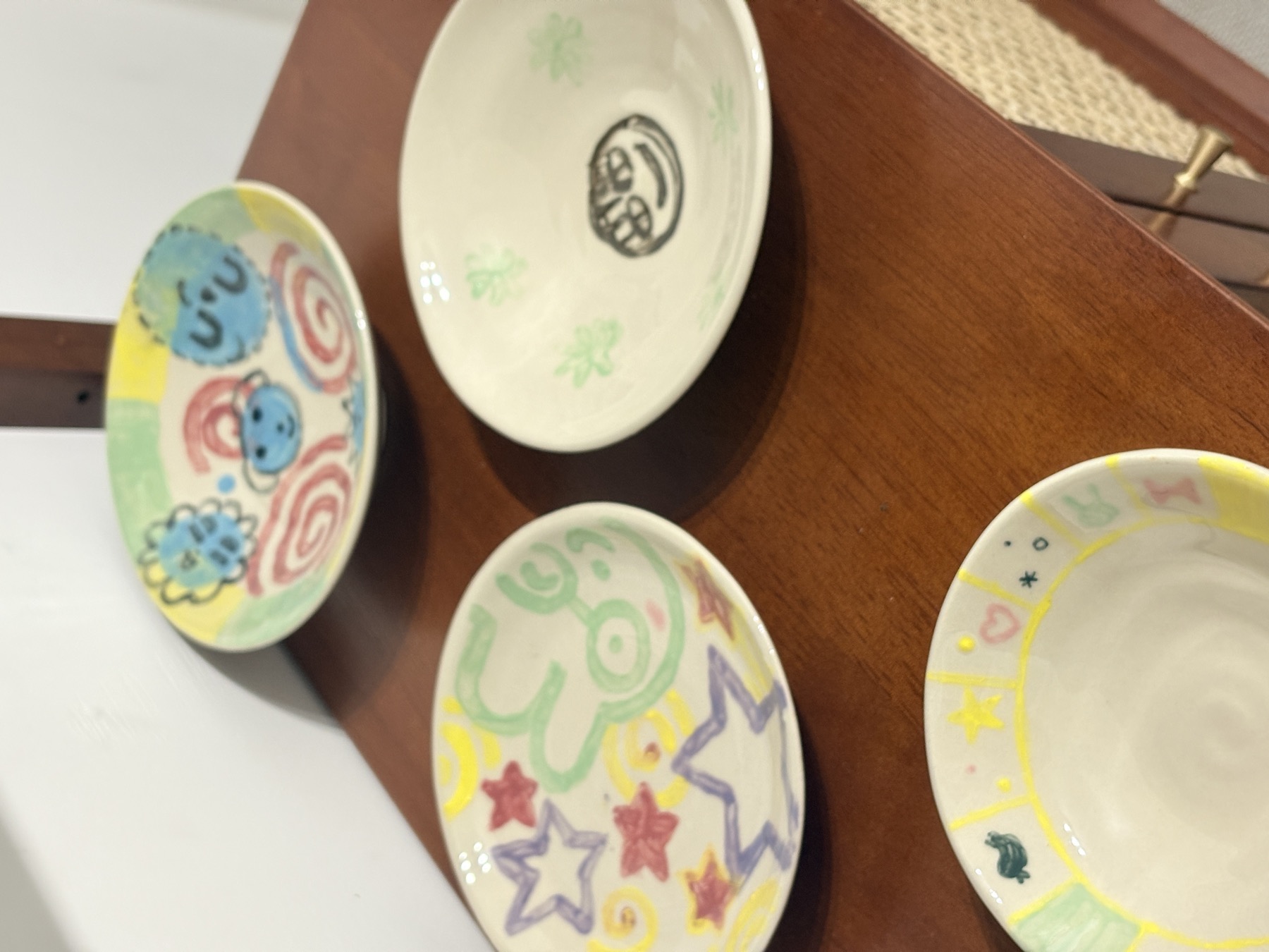 Colorful plates arranged on a shelf